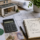 Architectural plans, house extension model, calculator and budget notes illustrating house extension costs in Devon.