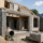 Partially completed home extension under construction in Newton Abbot showing brickwork, roof structure and building materials on site.