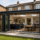 Modern rear home extension in Devon with open-plan kitchen, dining area and bi-fold doors opening onto the garden.