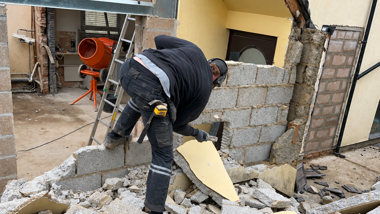 Construction worker carrying out demolition work during a property refurbishment project