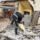 Construction worker carrying out demolition work during a property refurbishment project